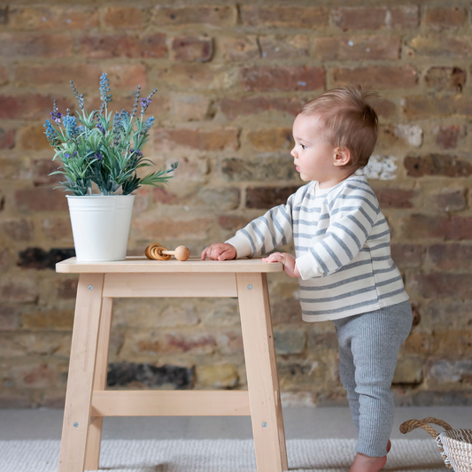 boy in grey stripe jumper and grey ribbed leggings